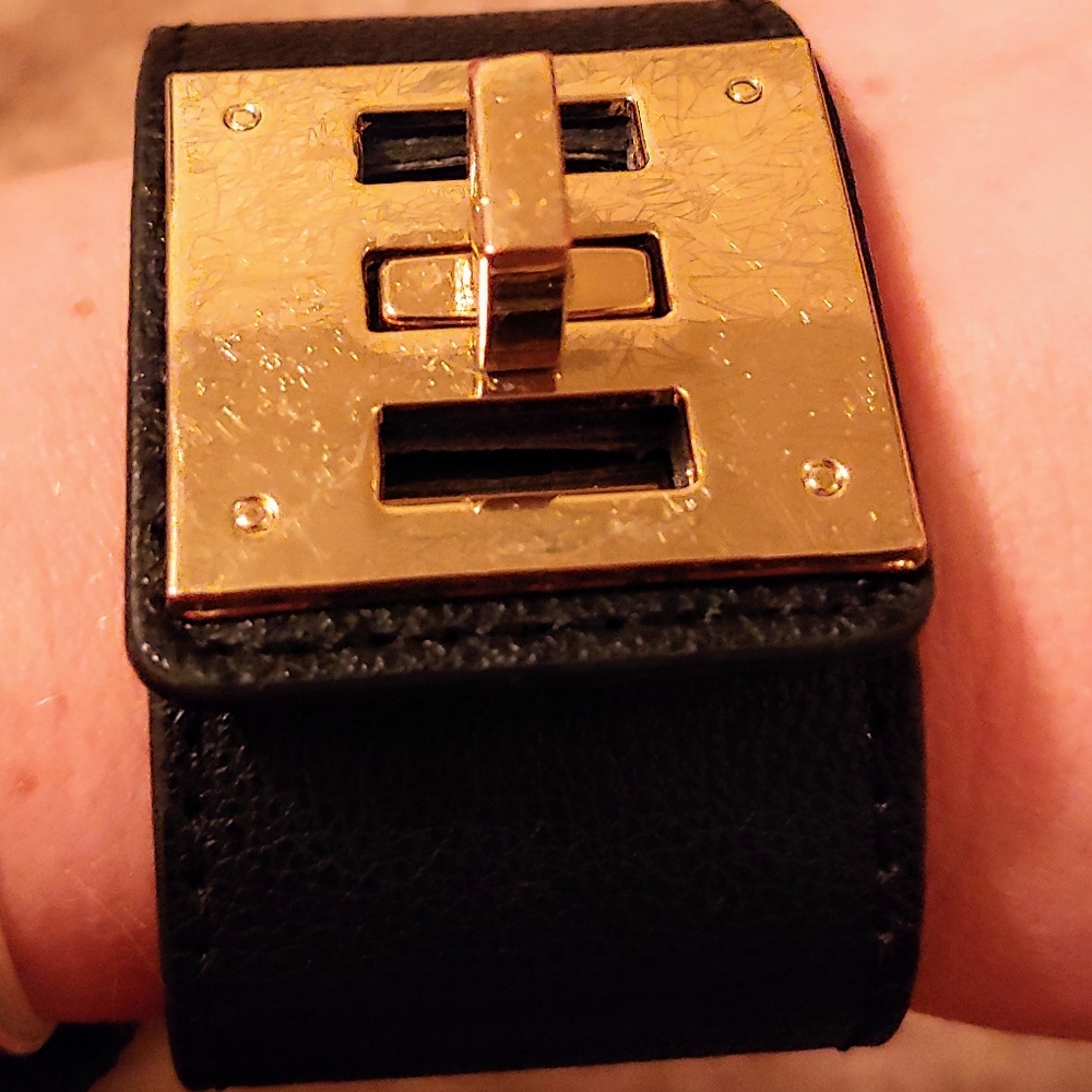 Black pleather and gold toned cuff bracelet